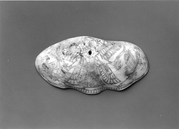 Shell with winged female deity